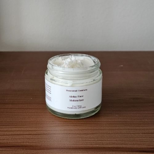 Homestead Comforts Aloha Face Moisturizer | Close-up of Aloha Face Moisturizer in jar, a nourishing daily cream with aloe, chamomile, and hyaluronic acid for hydration and skin barrier support